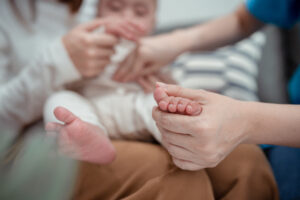 Female doctor pediatrician checking on child.