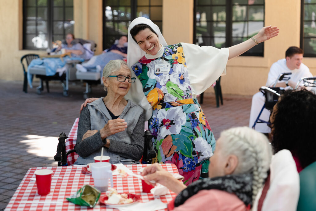 A Dominican Sister of Hawthorne with a resident at Rosary Hill Home in New York